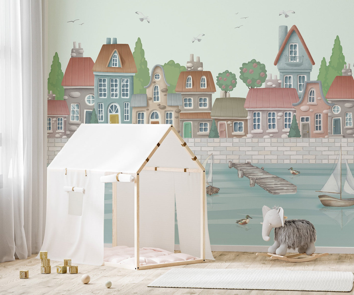 Vintage-inspired coastal wall mural with pastel rooftops.