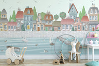 Illustrated coastal village wall mural with dock and swan details.