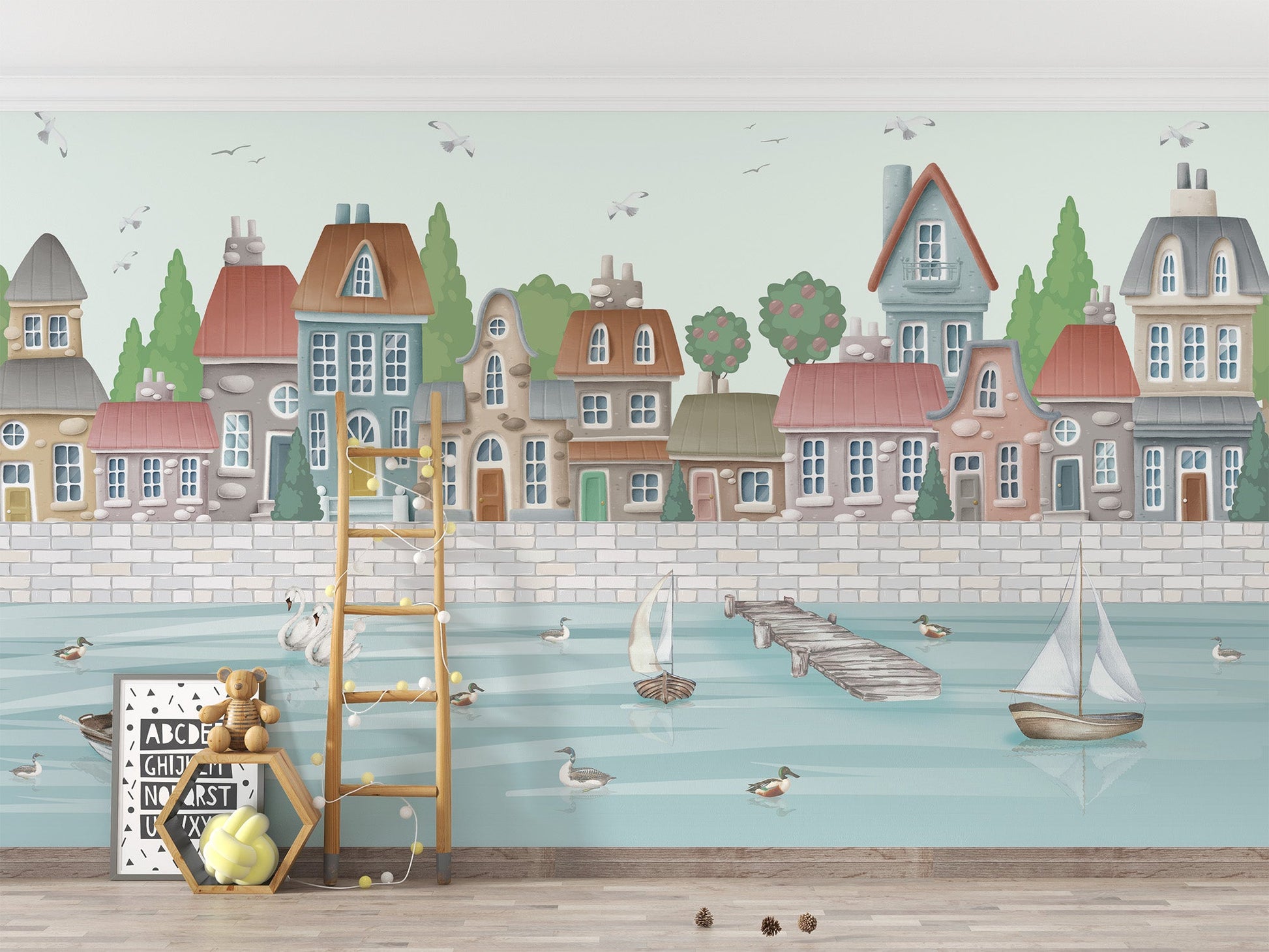 Soft watercolor coastal village wall mural with pastel buildings.