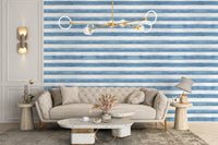 Elegant coastal-themed wallpaper mural with pastel watercolor stripes.