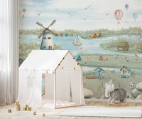 Scenic lake village wall mural with boats and marsh grasses.