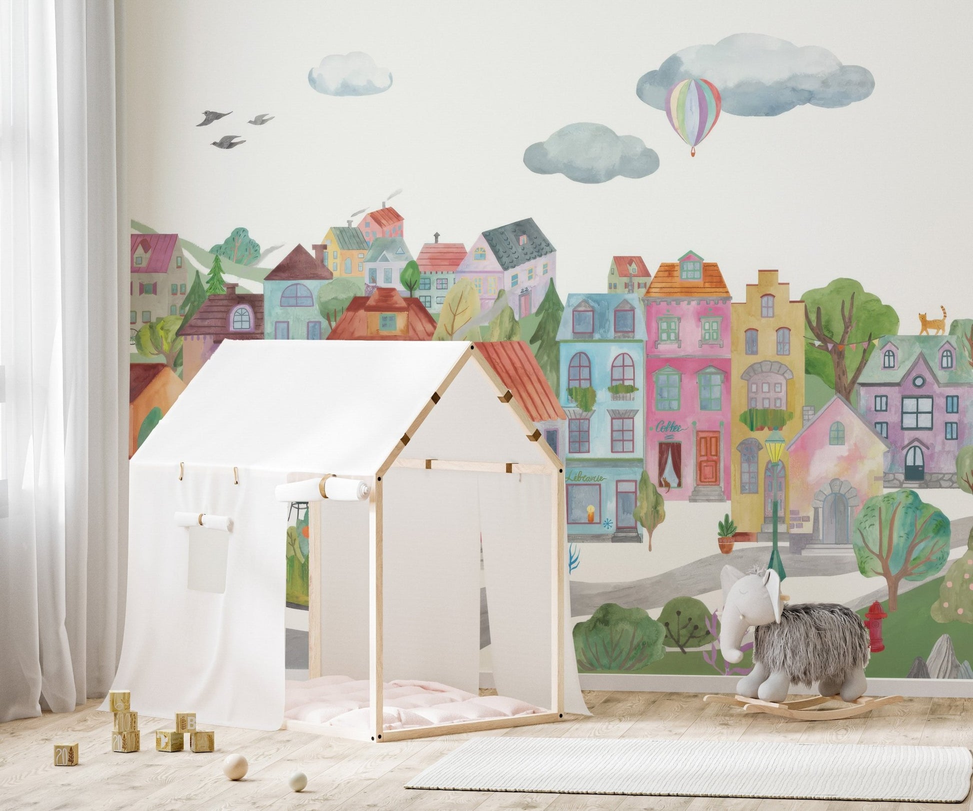 Artistic cityscape buildings wall mural with muted color wash.