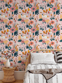 Floral pattern wallpaper on bedroom wall with white bedding and wooden side table.