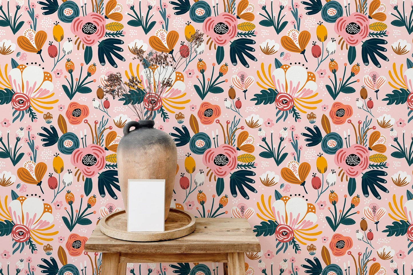 Pink floral wallpaper accent wall in room with table and vase.