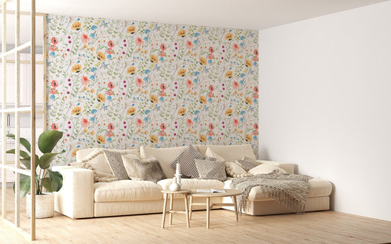 Large sofa in a bright living space with abstract floral wallpaper.