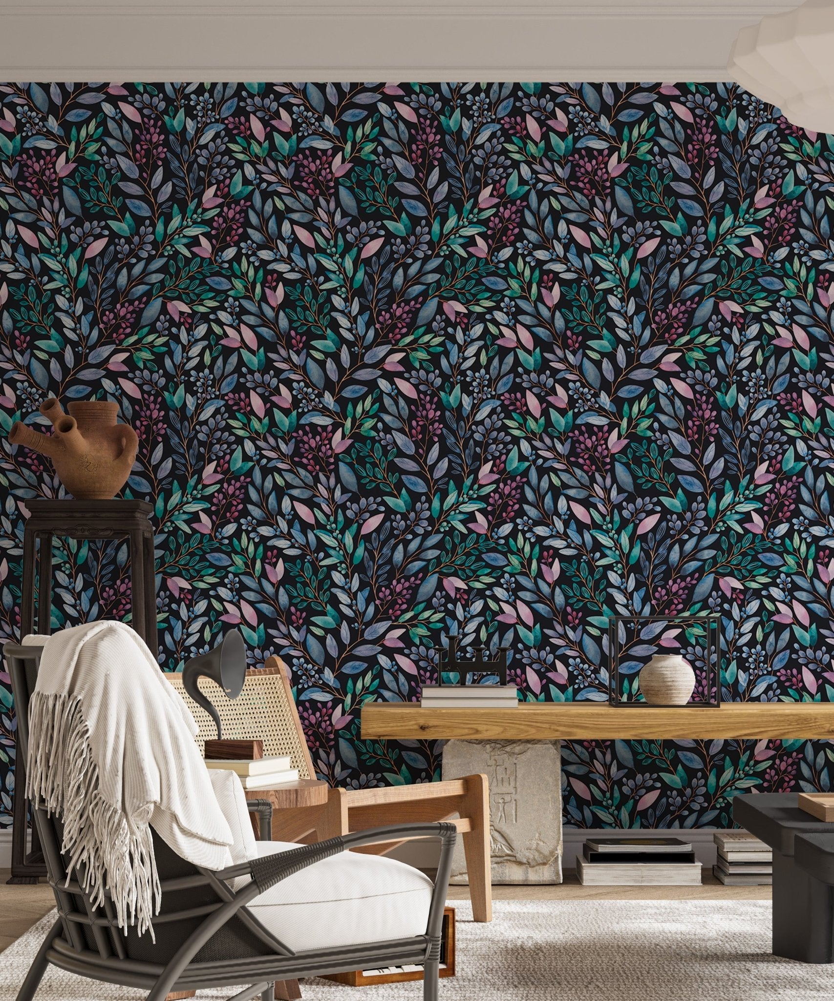 Hand painted leaves wallpaper in a modern living with a white accent chair.