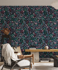 Hand painted leaves wallpaper in a modern living with a white accent chair.