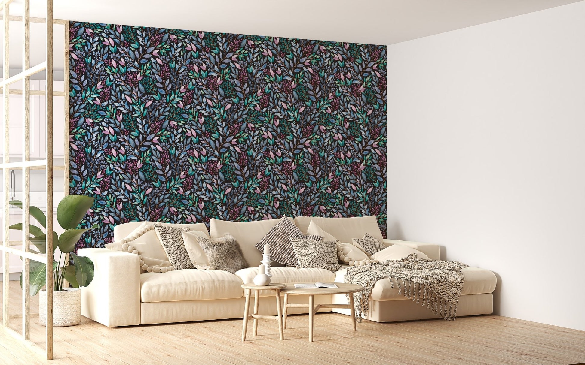 Floral leaves wallpaper behind a white sectional sofa in a bright living area.