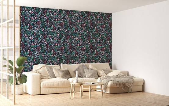 Floral leaves wallpaper behind a white sectional sofa in a bright living area.