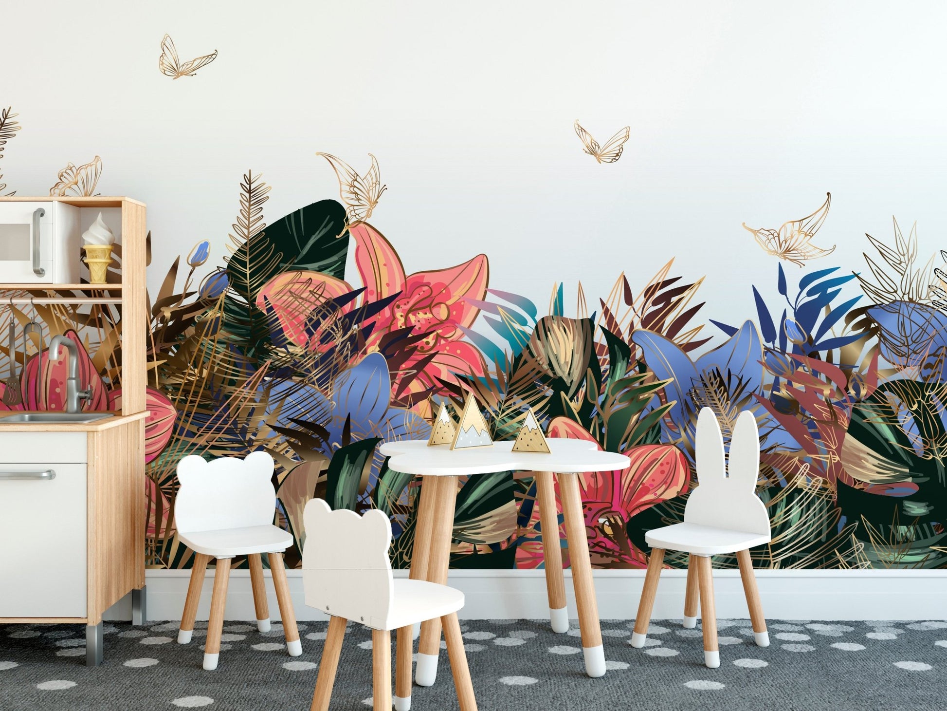 Floral delight wall mural behind a wooden table and white chairs for children.