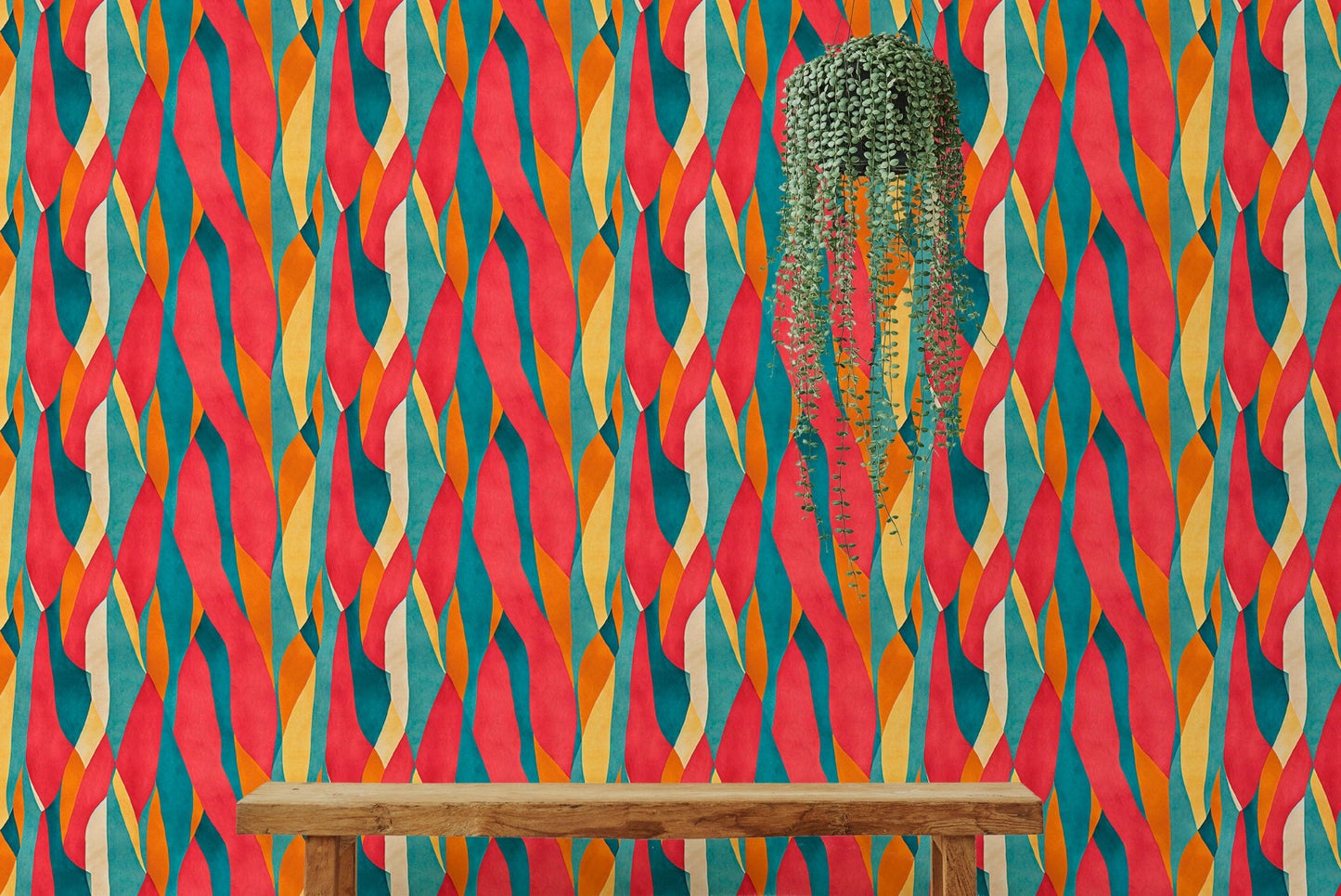 Bold vertical dyed pattern wall mural behind a wooden bench and hanging planter.