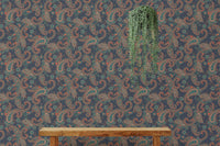 Traditional seamless wallpaper applied to a feature wall behind a wooden bench and plant.