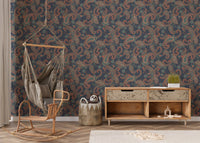 Patterned wallpaper behind a wooden cabinet and hanging chair in a nursery.