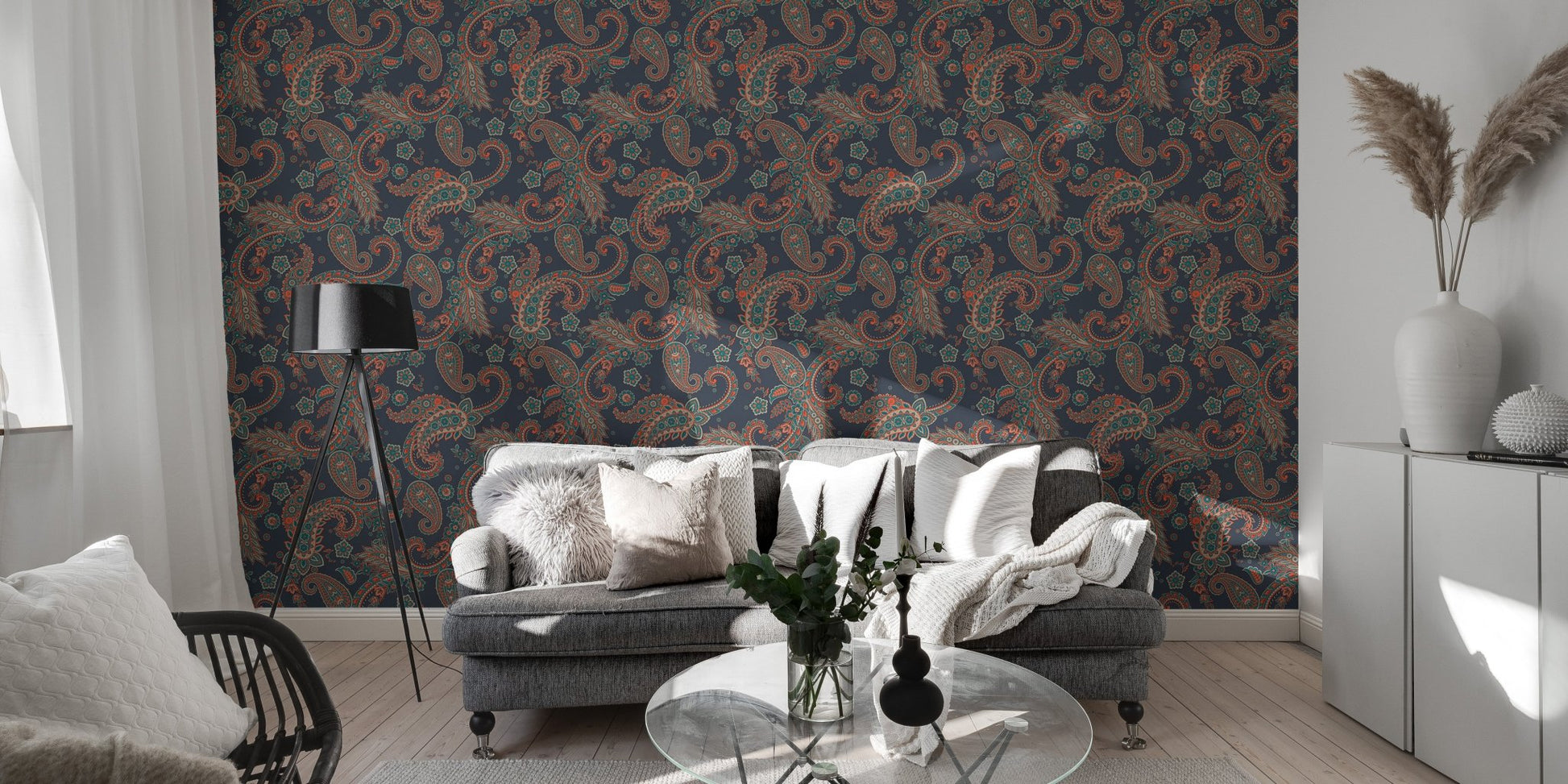 Dark blue seamless wallpaper with kalamkari elements behind a modern grey sofa.