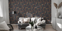 Dark blue seamless wallpaper with kalamkari elements behind a modern grey sofa.