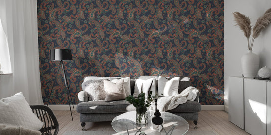 Dark blue seamless wallpaper with kalamkari elements behind a modern grey sofa.
