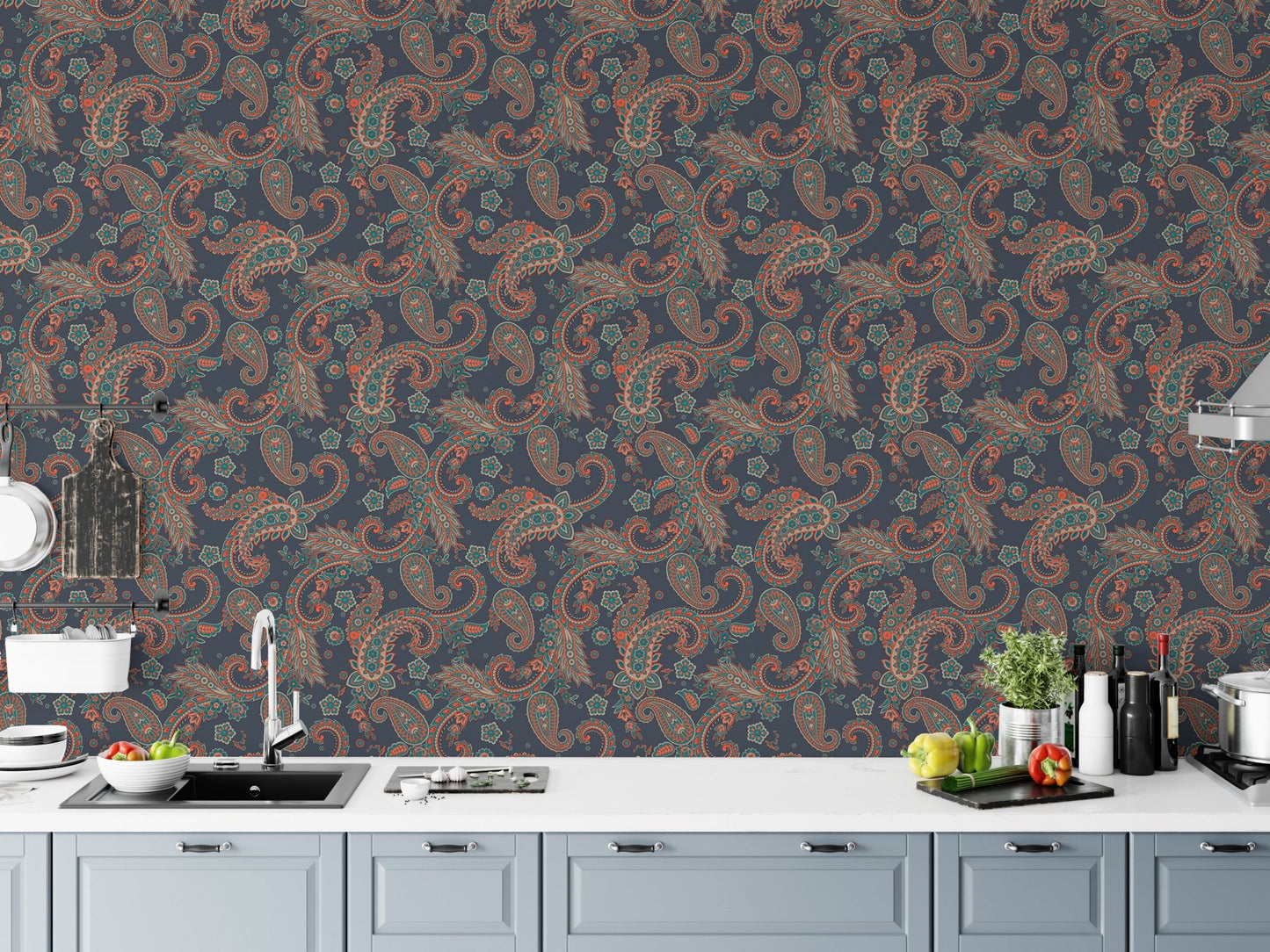 Traditional kalamkari wallpaper design applied as a kitchen backsplash above white cabinets.