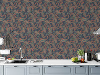 Traditional kalamkari wallpaper design applied as a kitchen backsplash above white cabinets.