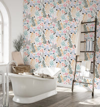 Bathroom with a white bathtub and moisture-resistant floral pattern wallpaper.