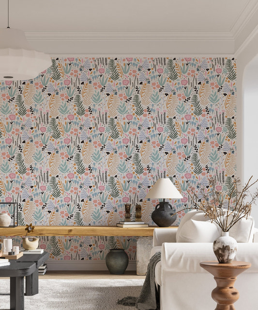 Living room with Colorful Leaves and Flower Repeat Pattern Wallpaper and white sofa.
