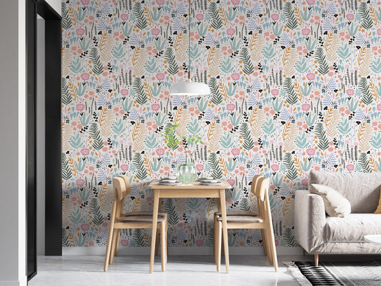 Dining room with wooden furniture and botanical flower print wallpaper in soft colors.