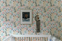 Nursery featuring floral wallpaper with pastel leaves behind a white crib.