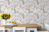Kitchen dining space with a white table and pastel floral pattern wallpaper.