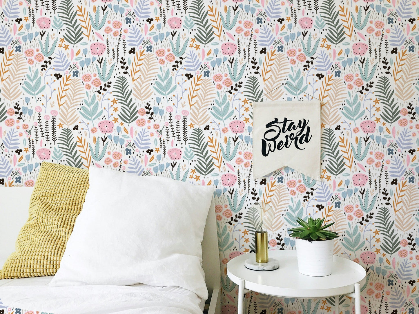 Bedroom with white bedding and Colorful Leaves and Flower Repeat Pattern Wallpaper.