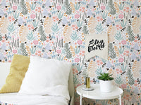 Bedroom with white bedding and Colorful Leaves and Flower Repeat Pattern Wallpaper.