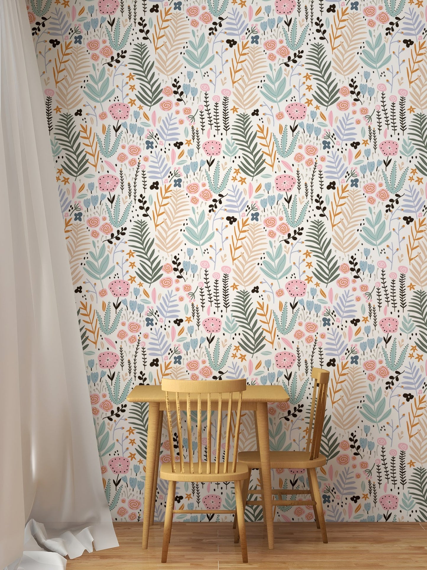 Kid's dining area with a wooden table and chair against a leaves pattern wallpaper.
