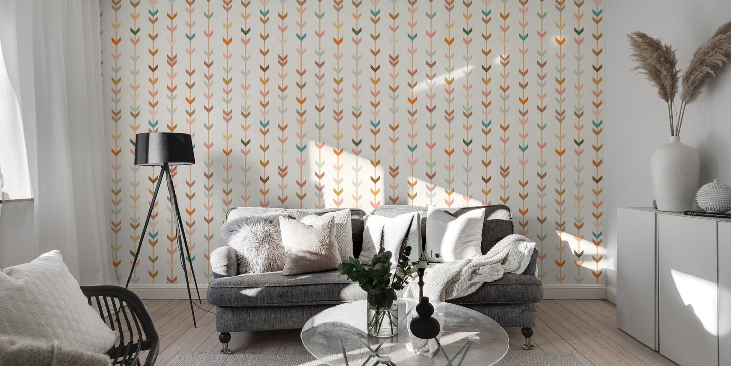 Grey sofa set against a wallpaper with repeating small geometric shapes.