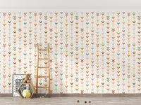 Kids play area with geometric wallpaper and a wooden ladder leaning on the wall.