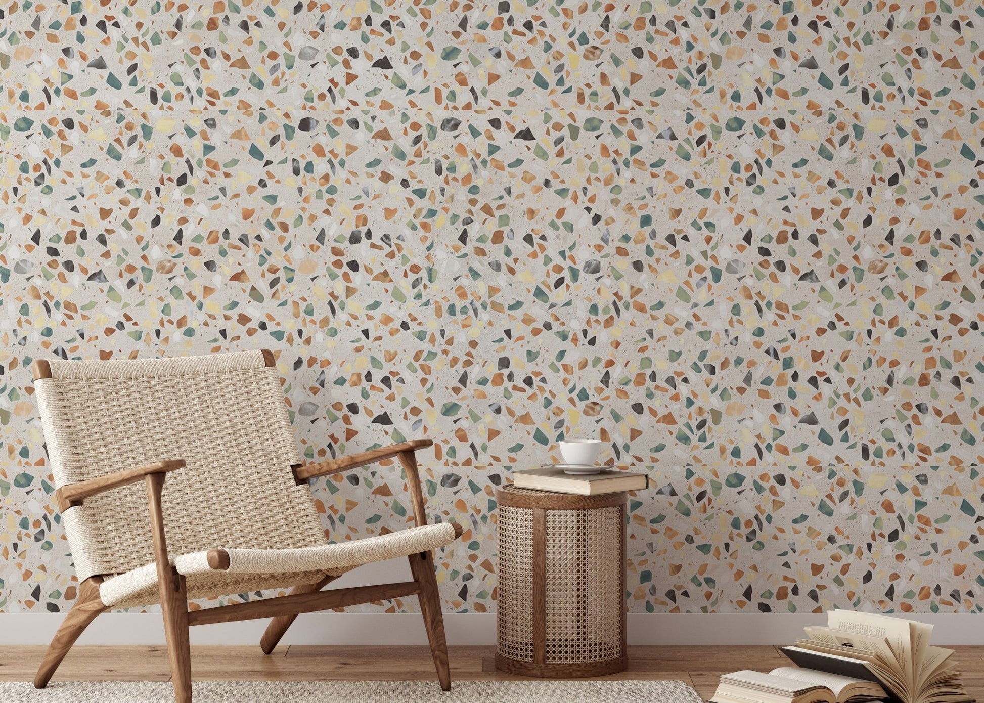 Reading corner with a wooden armchair and stone chip pattern wallpaper.