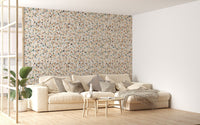 Large living space with a white sofa and terrazzo texture wallpaper.