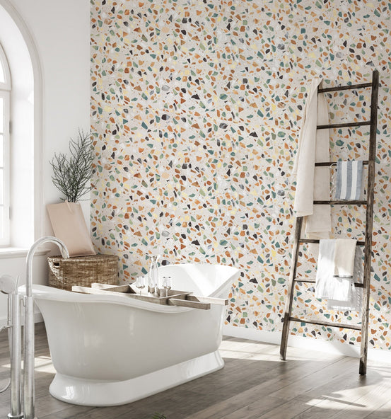 Bathroom interior with a freestanding tub and stone texture wallpaper.