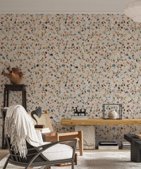 Living room wallpaper featuring colorful stone chip patterns and wooden desk.