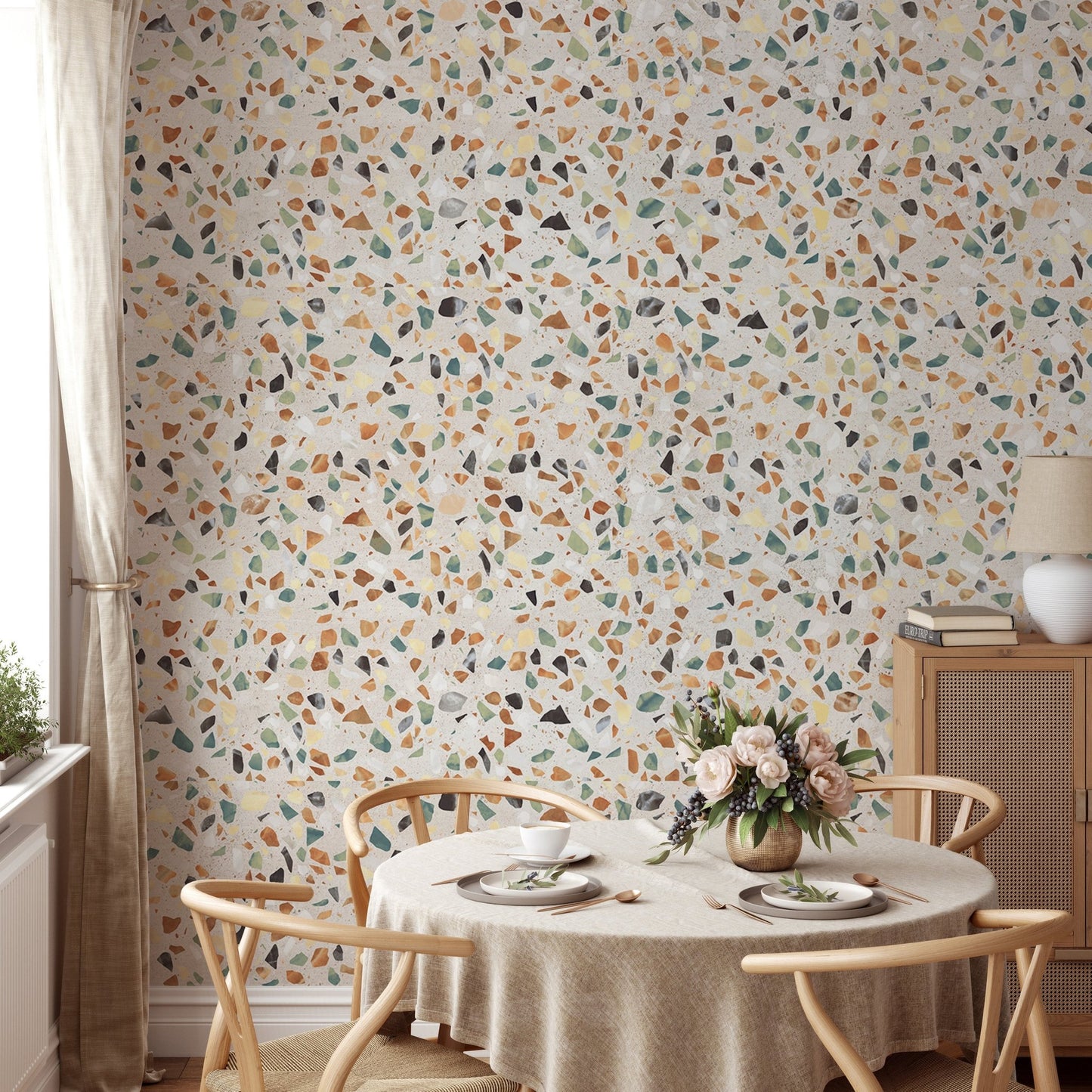 Round dining table set against a mosaic stones background wallpaper.