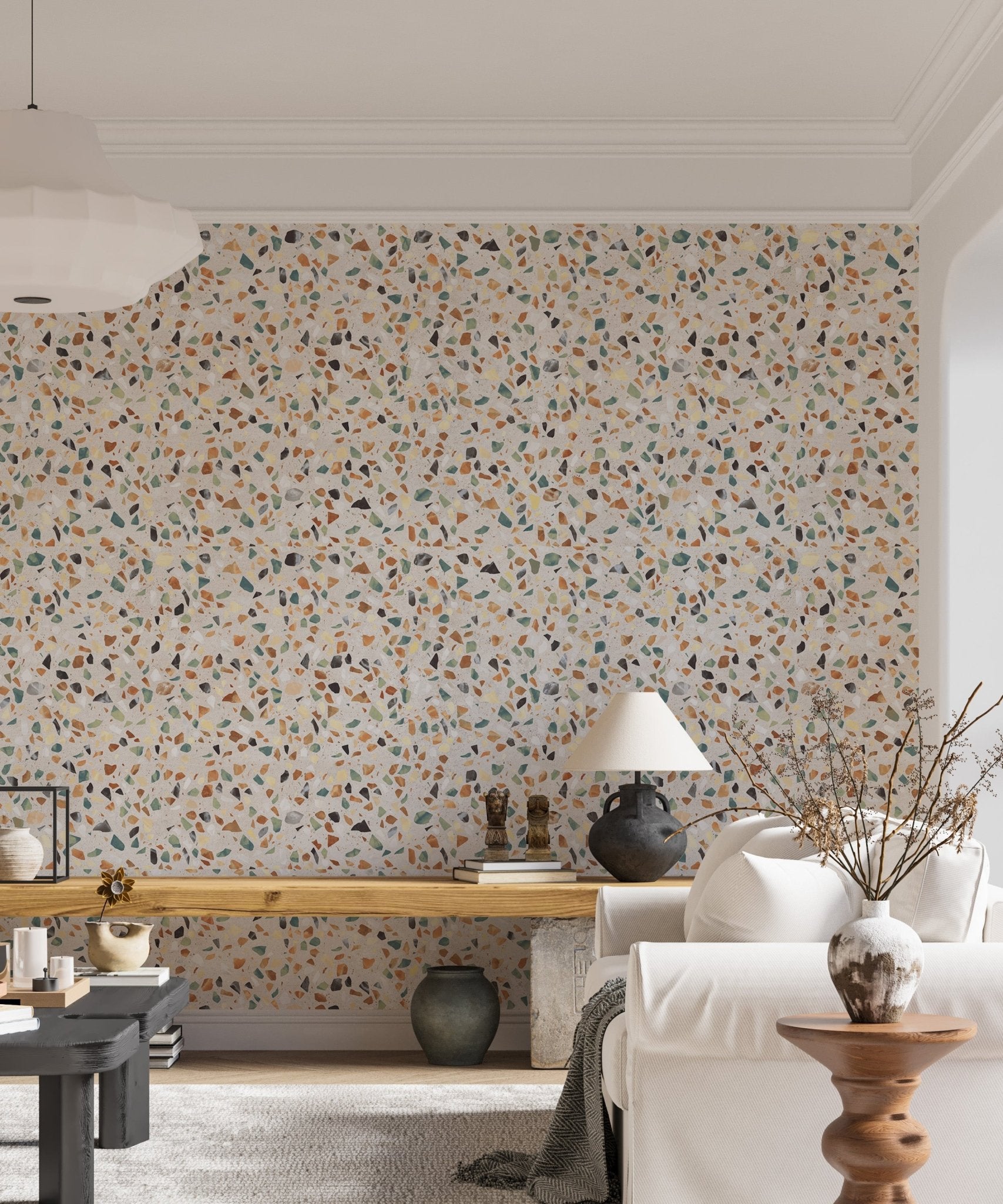 Living area with a wooden console and terrazzo wallpaper.