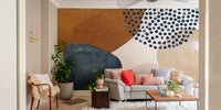 Living room view with grey chairs and abstract watercolor wall mural.