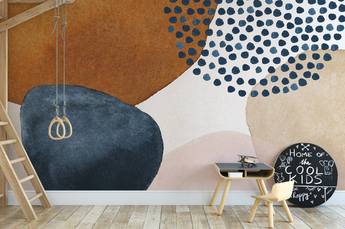 Children’s play area with navy blue and terracotta watercolor wall mural.