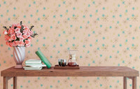 Pastel background mural on a wall behind a dark wood console table with a flower vase.