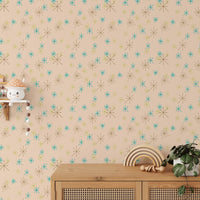 Colorful snow fleck illustration wall mural in a room with a wooden cabinet and green plant.