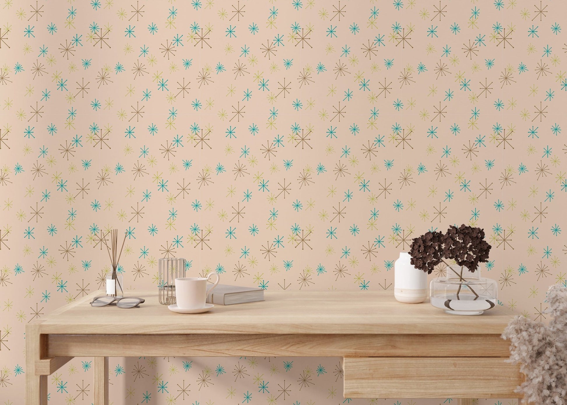 Workspace featuring a light wood desk positioned against a pastel background wall mural.