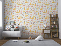 Pastel yellow and pink summer pattern wallpaper for nursery walls.