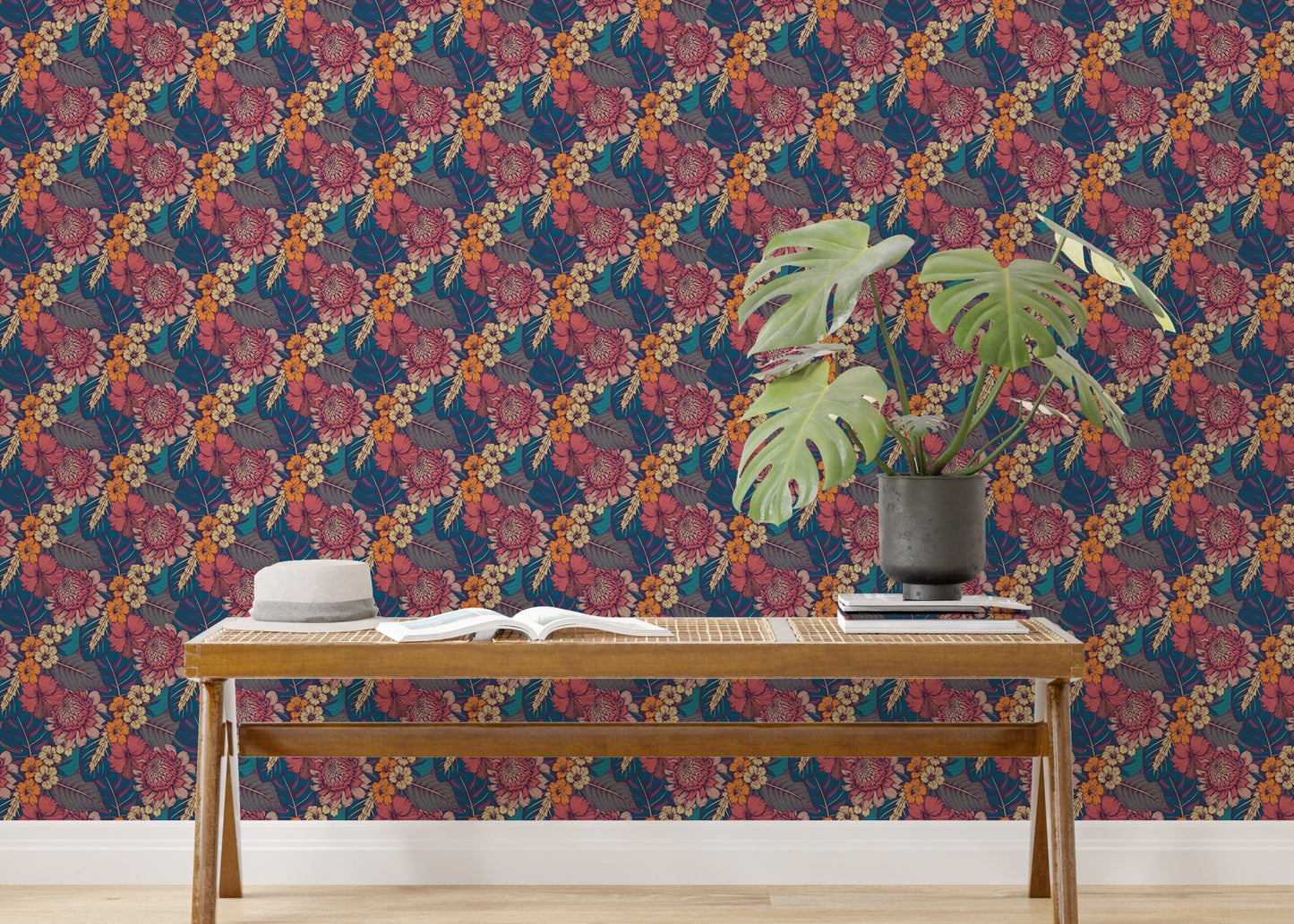 Tropical wallpaper with pink and orange flowers behind a wooden bench.