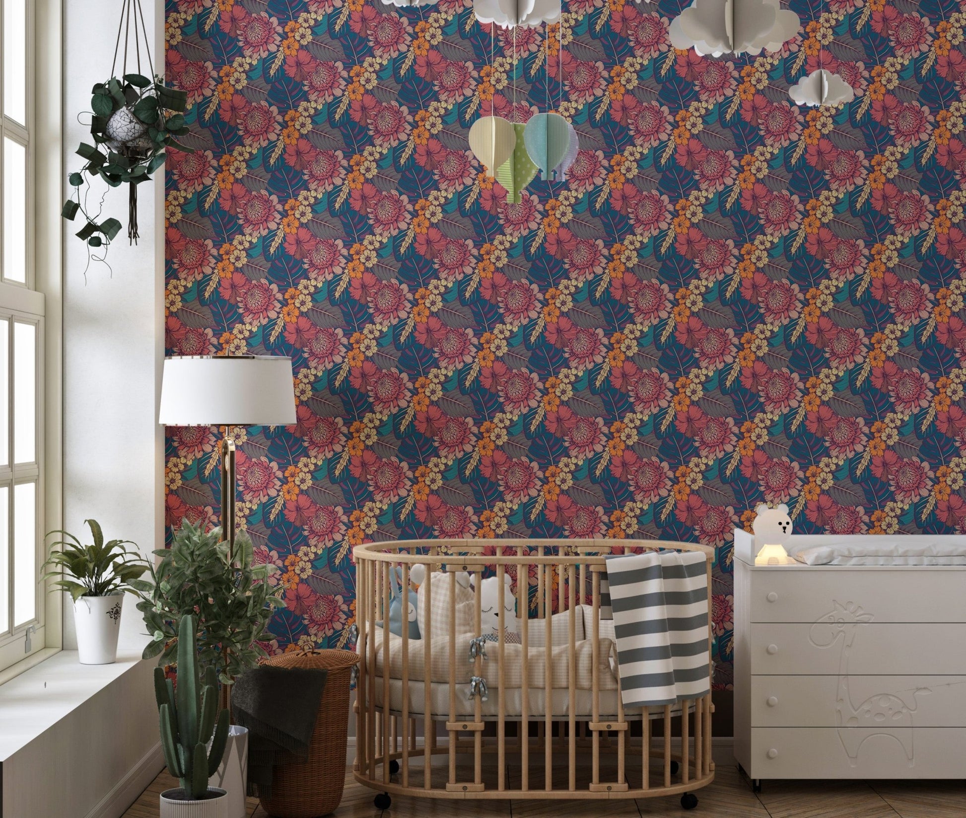 Colorful Tropical Flower Peel and Stick Wallpaper in a nursery with a wooden crib.