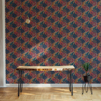 Multi-colored floral wallpaper behind a minimalist black metal table.