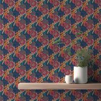 Dark blue wallpaper with orange and pink flowers behind a floating wooden shelf.