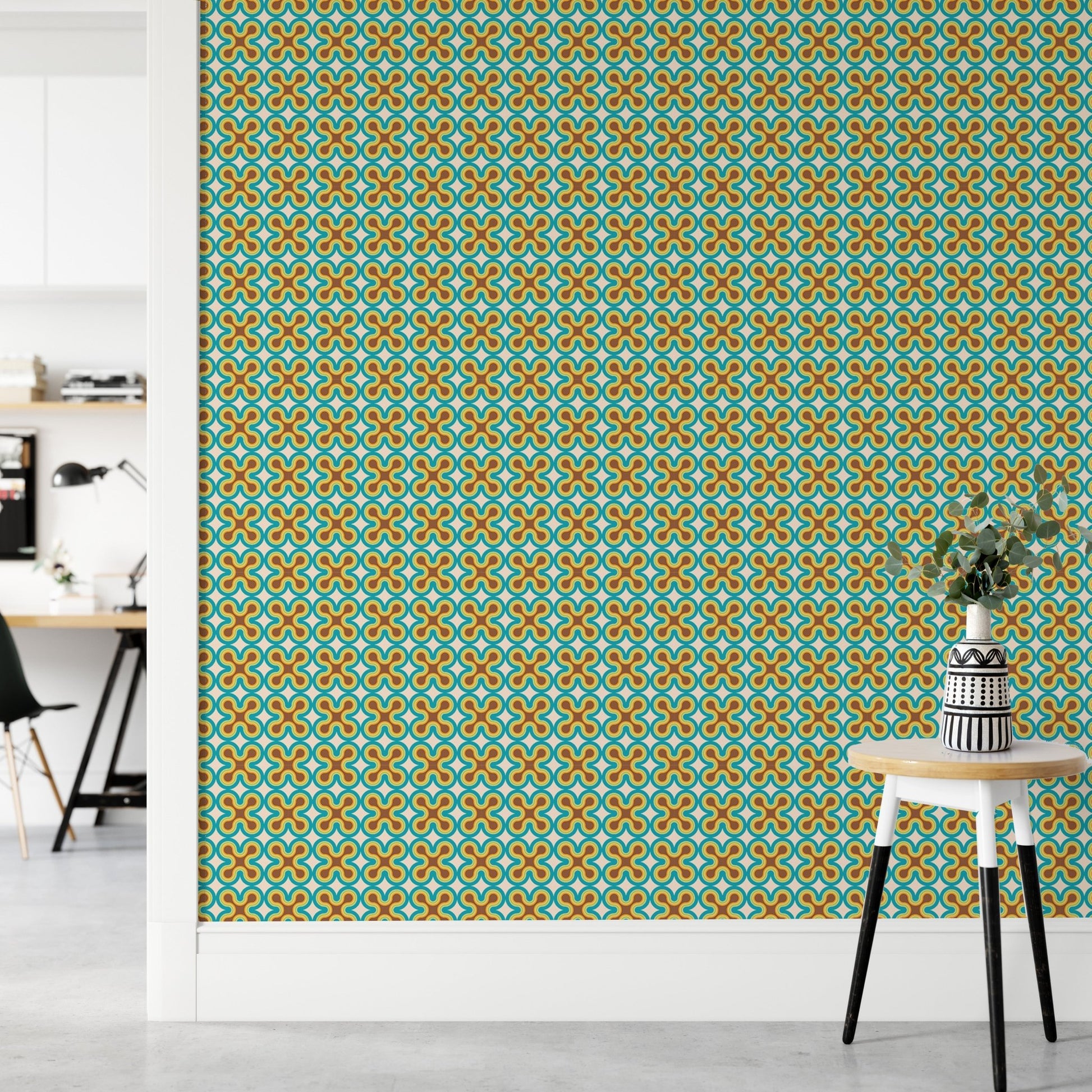 Teal and gold geometric art wall mural in a minimalist workspace setup.