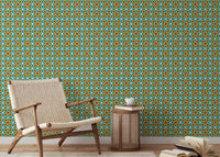 Teal and orange pattern wall mural in a sitting room with a side table.